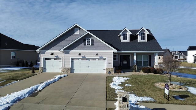 view of front of home with a garage and a front lawn