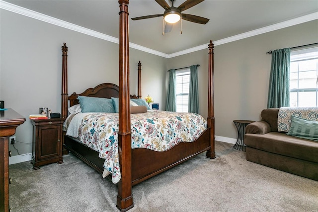 carpeted bedroom featuring ornamental molding and ceiling fan