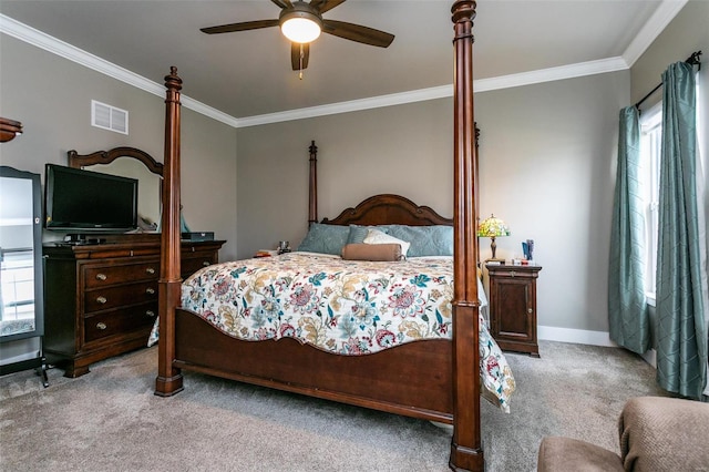 carpeted bedroom featuring ceiling fan, ornamental molding, and multiple windows