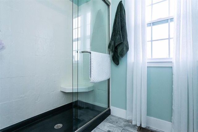 bathroom featuring an enclosed shower