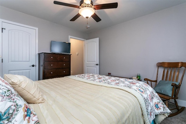 bedroom with ceiling fan and carpet flooring