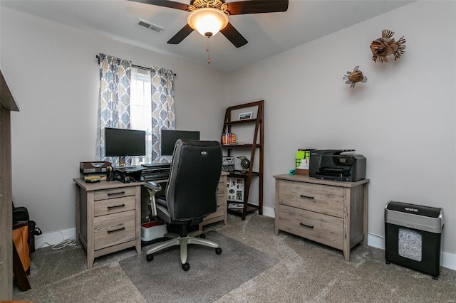 office area with ceiling fan and dark carpet