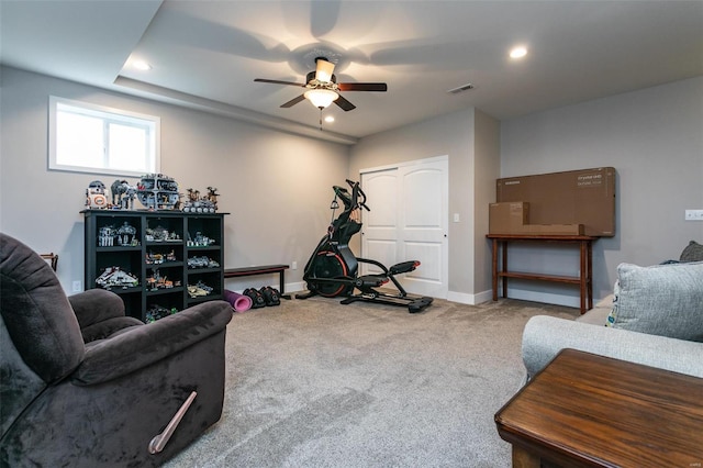 living room with ceiling fan and carpet flooring