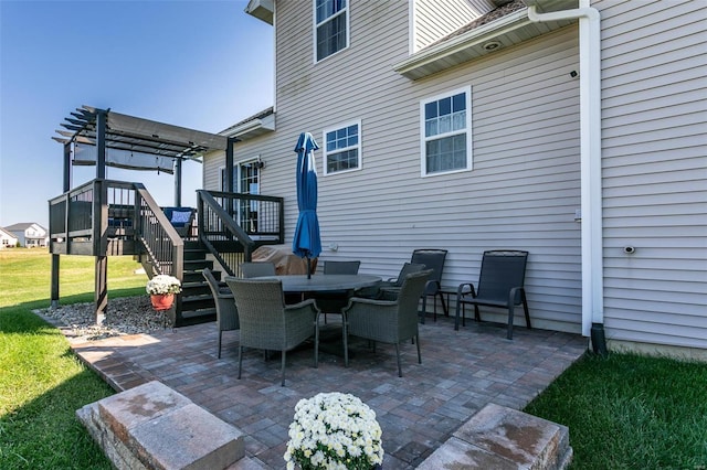 view of patio / terrace with a wooden deck and a pergola