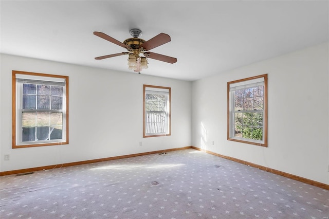 unfurnished room with light colored carpet and ceiling fan