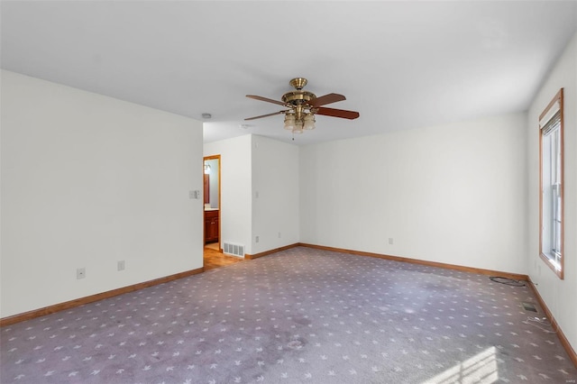 empty room featuring ceiling fan