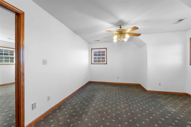 empty room with carpet flooring and ceiling fan