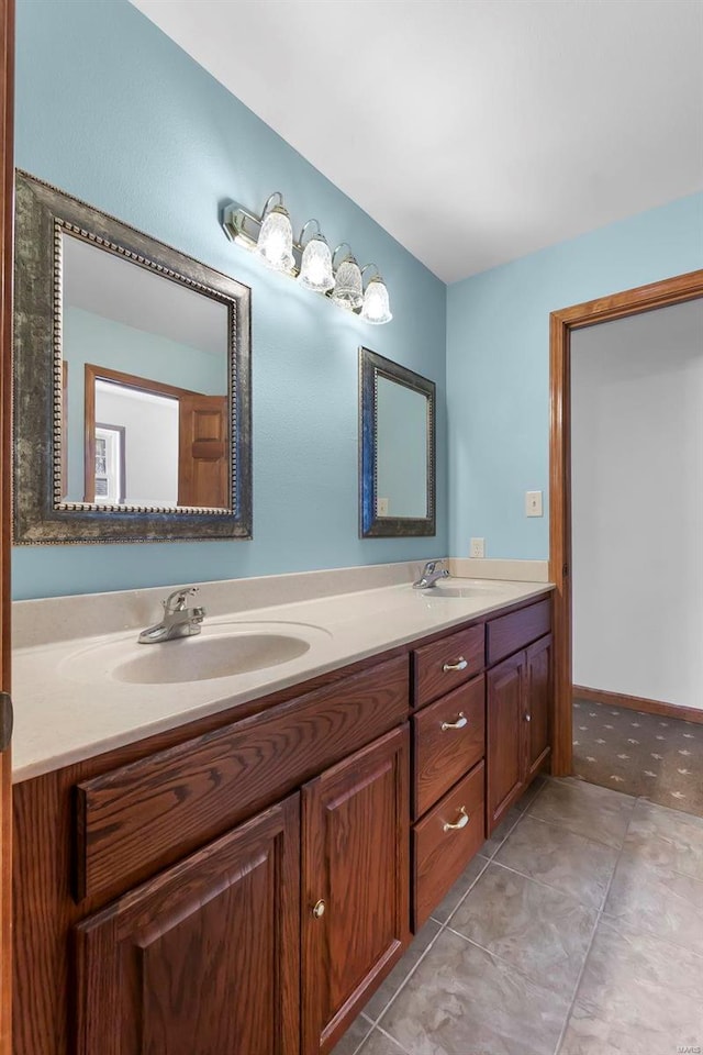 bathroom featuring tile patterned flooring and vanity