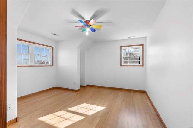 additional living space with ceiling fan and light hardwood / wood-style flooring