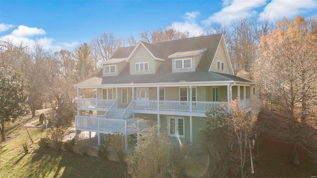 exterior space featuring covered porch and french doors