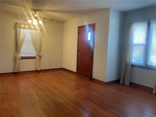 interior space with ceiling fan and hardwood / wood-style flooring