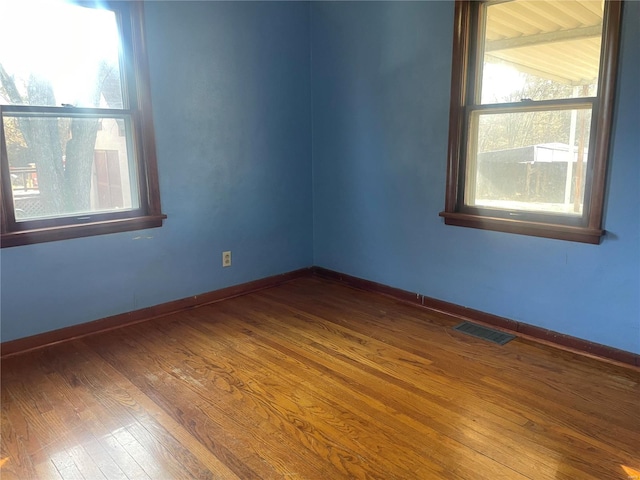 spare room featuring hardwood / wood-style flooring