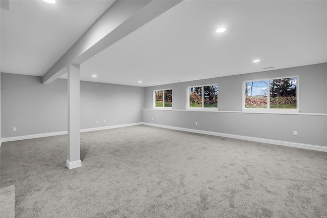 basement with carpet flooring and a wealth of natural light