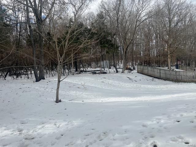 view of yard layered in snow