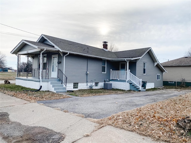 view of front of home featuring a porch and central AC