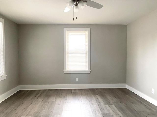 unfurnished room featuring hardwood / wood-style flooring and ceiling fan