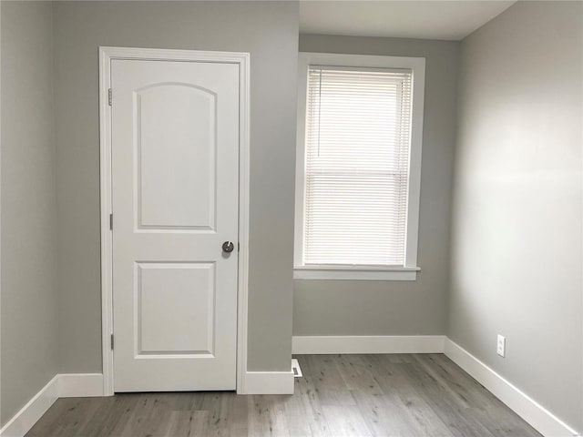 spare room with light hardwood / wood-style floors