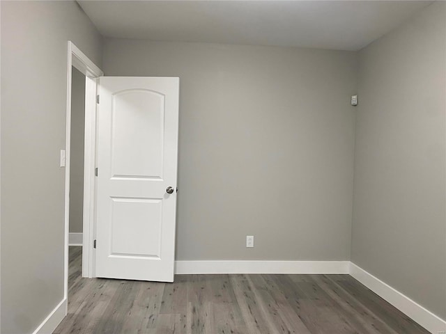 unfurnished room featuring light hardwood / wood-style floors