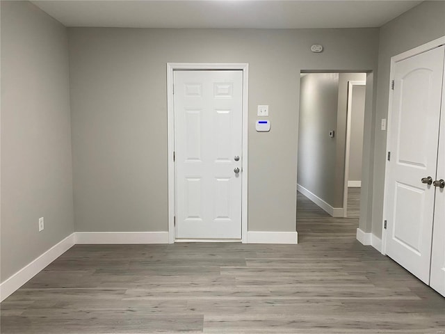 entryway with light hardwood / wood-style flooring