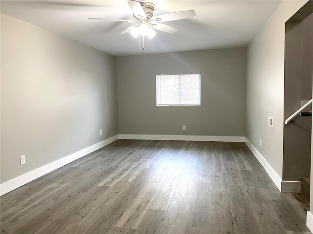 unfurnished room featuring hardwood / wood-style floors and ceiling fan