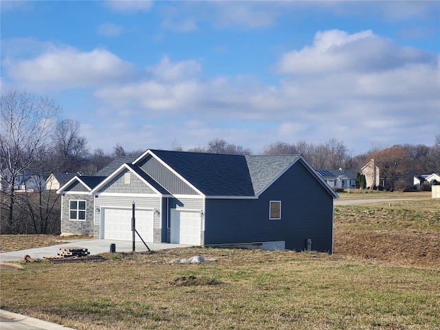 view of front facade with a front lawn and a garage