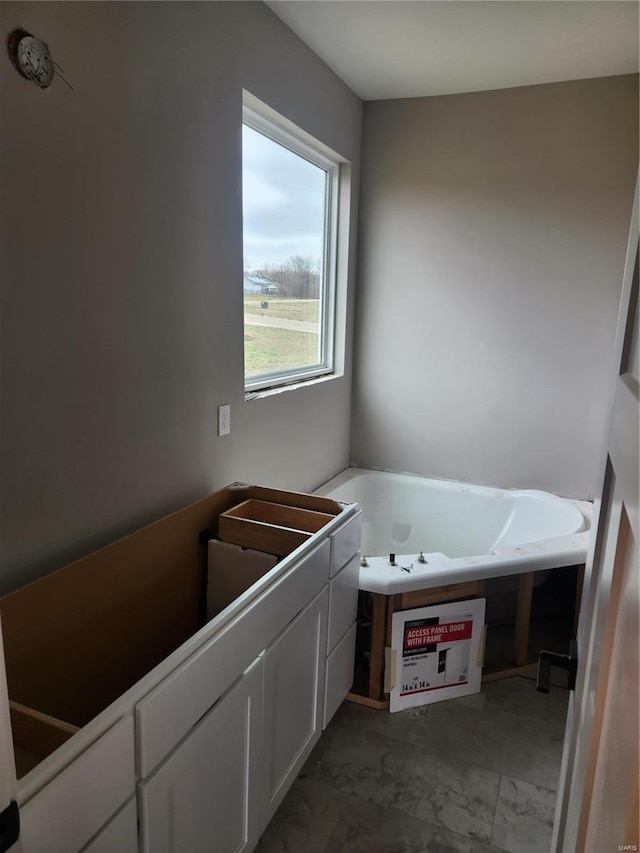 bathroom featuring a washtub