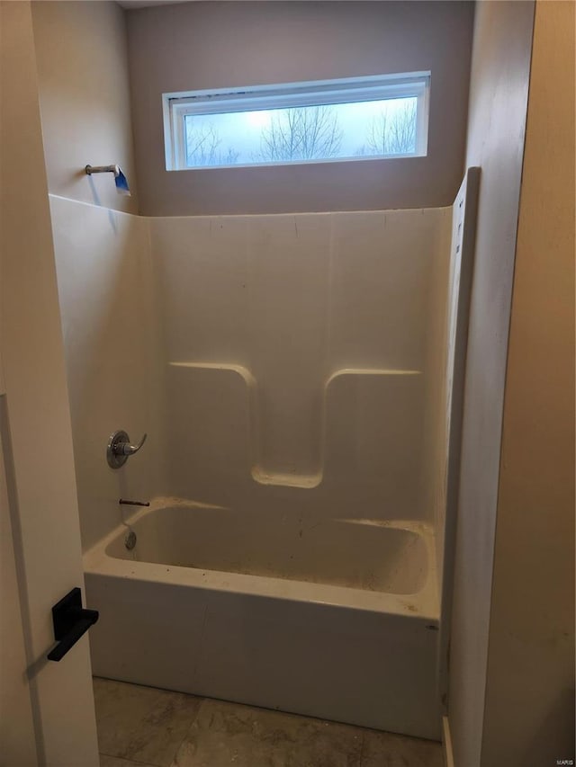 bathroom featuring washtub / shower combination