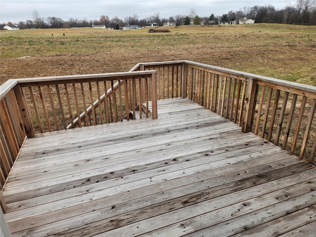 wooden deck featuring a rural view