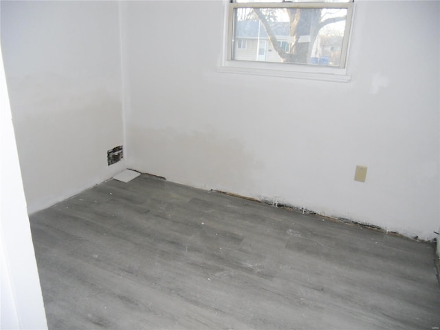 unfurnished room with dark hardwood / wood-style floors