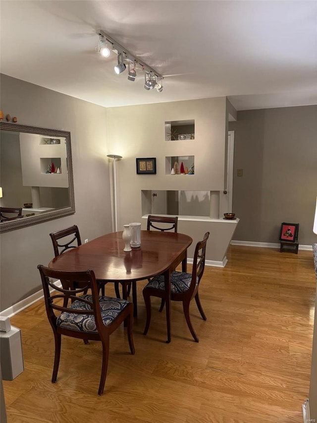 dining area featuring light wood-type flooring