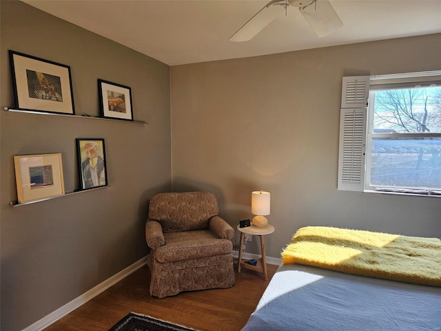 bedroom with ceiling fan and dark hardwood / wood-style flooring