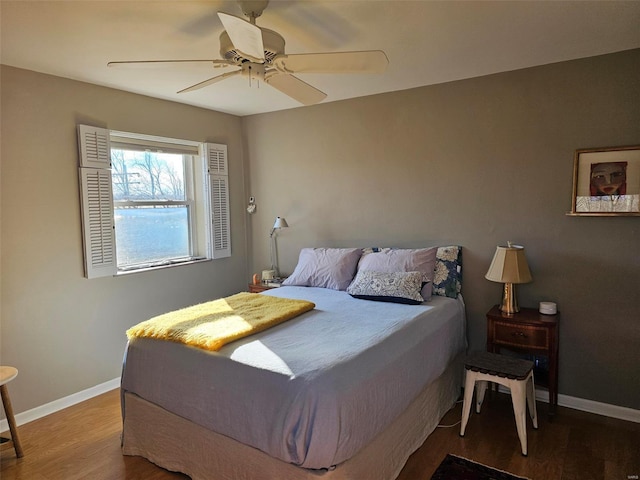 bedroom with hardwood / wood-style floors and ceiling fan