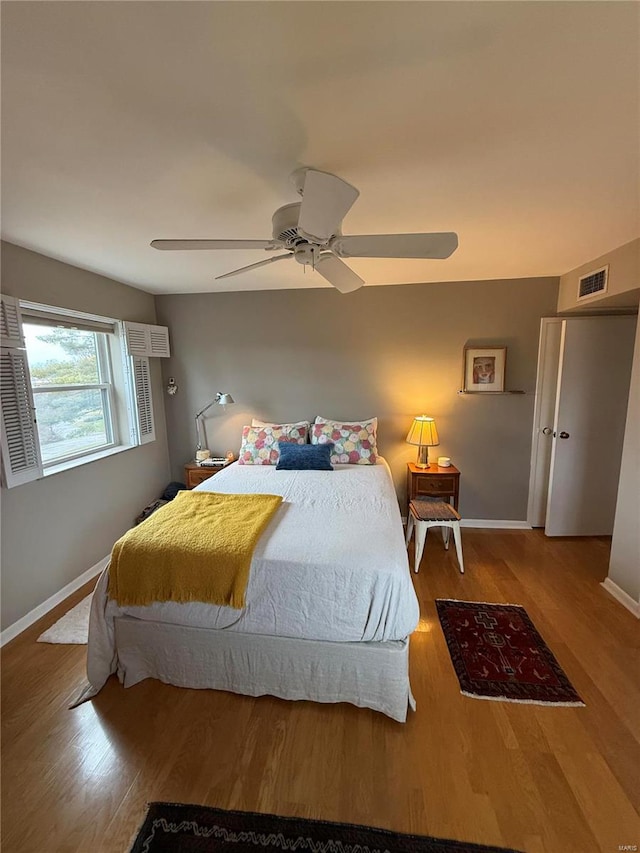 bedroom featuring ceiling fan and light hardwood / wood-style floors