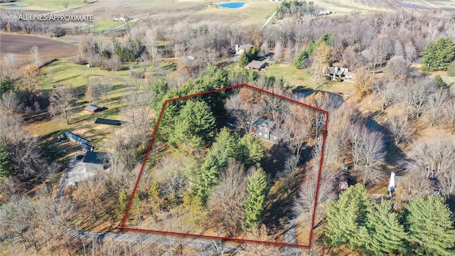 birds eye view of property with a rural view