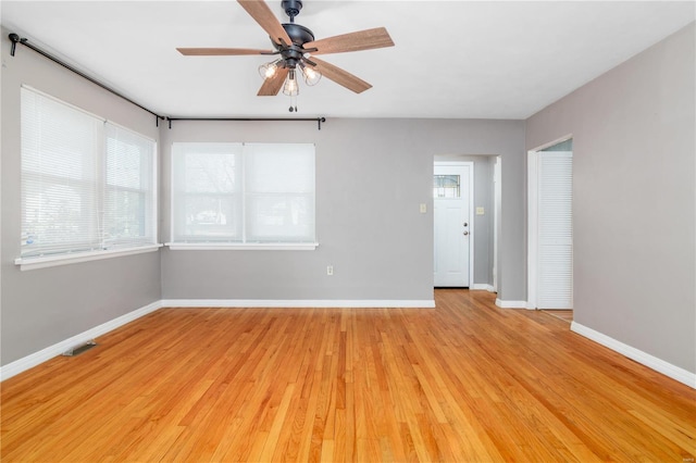 unfurnished room featuring light hardwood / wood-style floors and ceiling fan