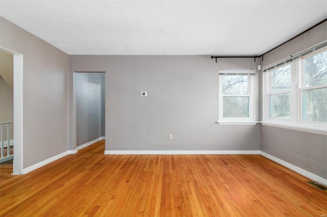 unfurnished room with light hardwood / wood-style flooring