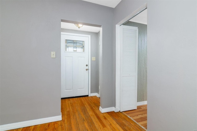 foyer entrance with hardwood / wood-style floors