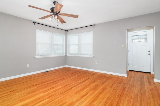 spare room with ceiling fan and light hardwood / wood-style flooring