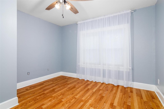 spare room with light hardwood / wood-style floors and ceiling fan