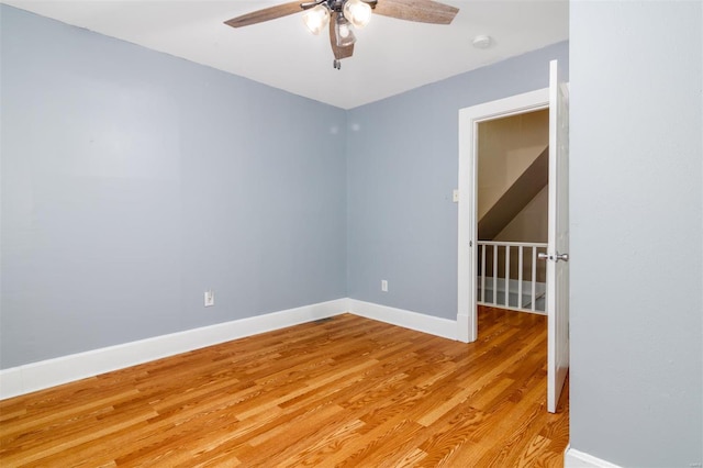 unfurnished room featuring light hardwood / wood-style floors and ceiling fan