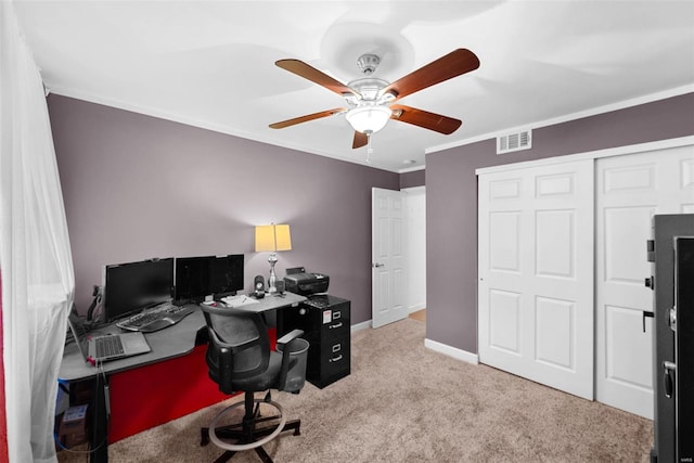 carpeted office space with ceiling fan and crown molding