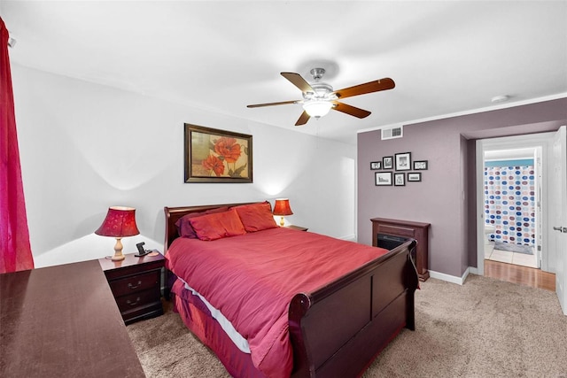 bedroom featuring light colored carpet and ceiling fan