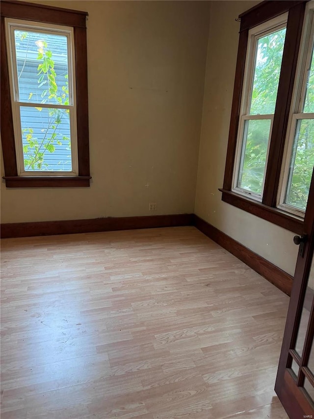 spare room featuring light hardwood / wood-style floors