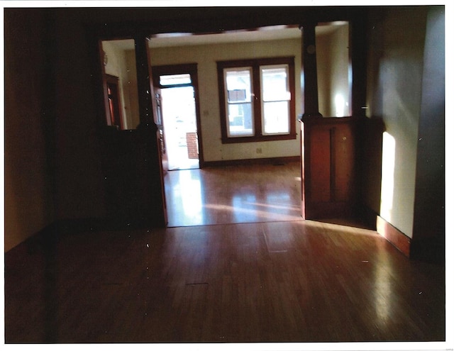 empty room featuring dark wood-type flooring