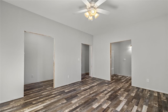 unfurnished bedroom with ceiling fan and dark hardwood / wood-style floors