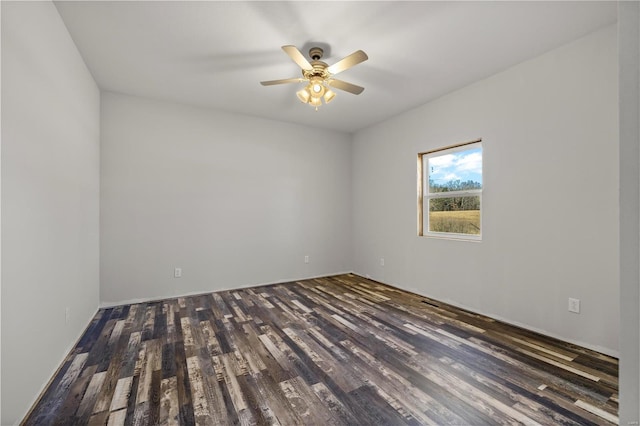 empty room featuring ceiling fan and dark wood-type flooring