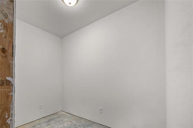 spare room with concrete flooring