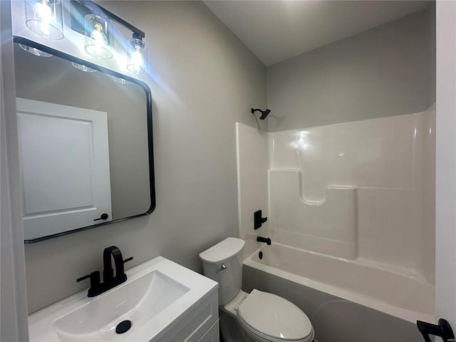 full bathroom featuring toilet, vanity, and bathtub / shower combination