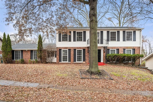 view of front of home featuring a balcony