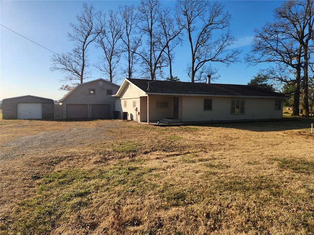 back of house featuring a garage